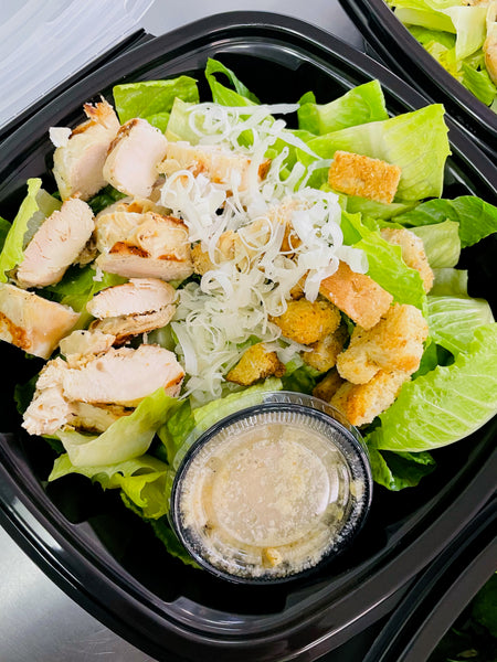 House Artesian Caesar Chicken Salad with grilled chicken, romaine lettuce, shredded cheese, croutons, and dressing cup